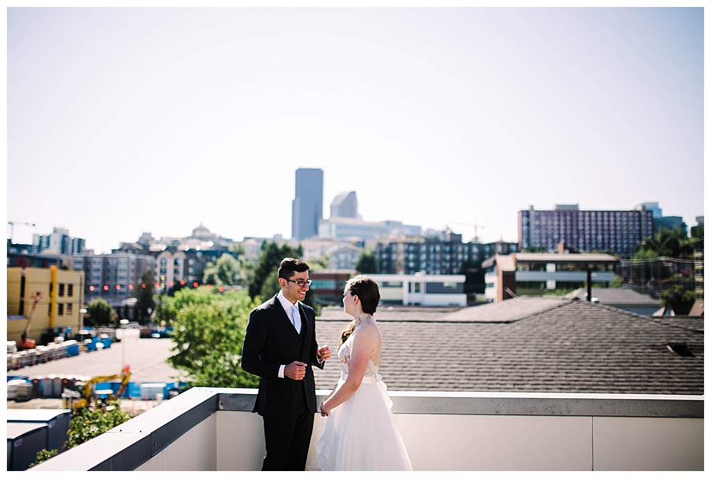 rooftop, first look, offbeat bride, seattle aquarium, aquarium wedding, seattle engagement, seattle bride, seattle groom, julia kinnunen photography, destination wedding, seattle wedding, wedding photography, newlyweds, diy wedding, flying anchor event design, seattle bride magazine, urban wedding, evening wedding