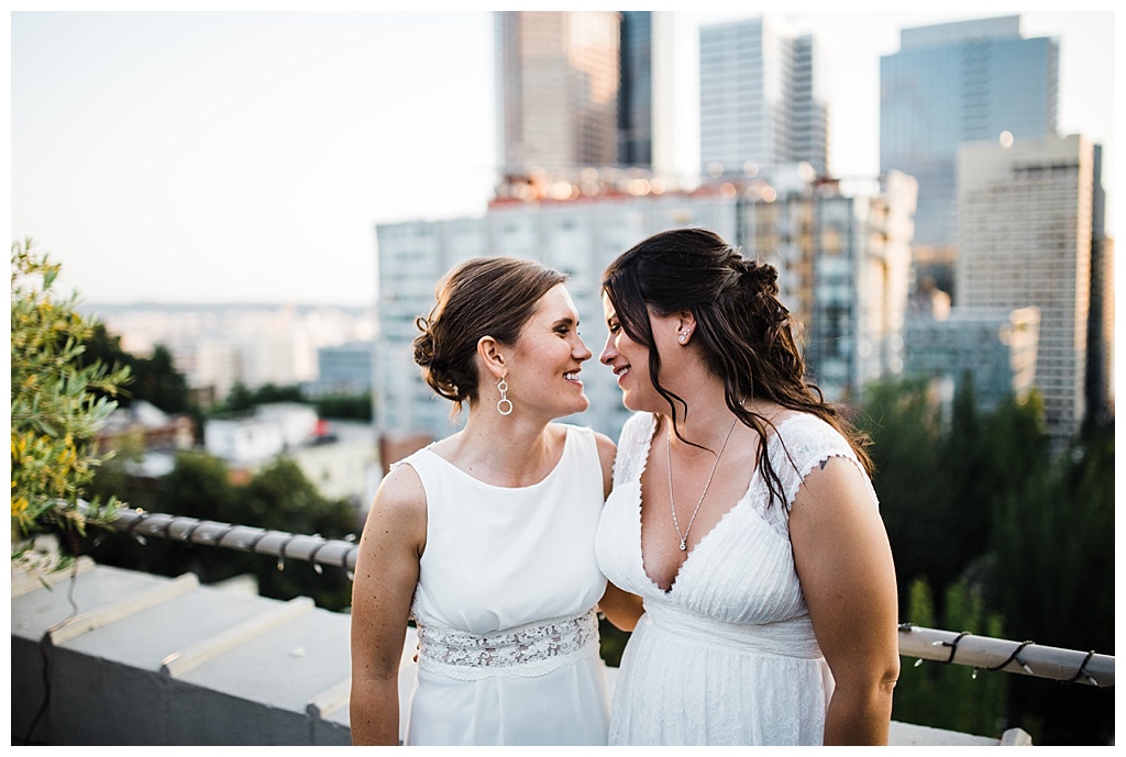 lesbian wedding, offbeat bride, lgbt wedding, gay wedding, two brides, sorrento hotel, boutique hotel wedding, julia kinnunen photography, destination wedding, seattle wedding, wedding photography, bride, newlyweds, same sex wedding, reception, portraits, sunset, rooftop