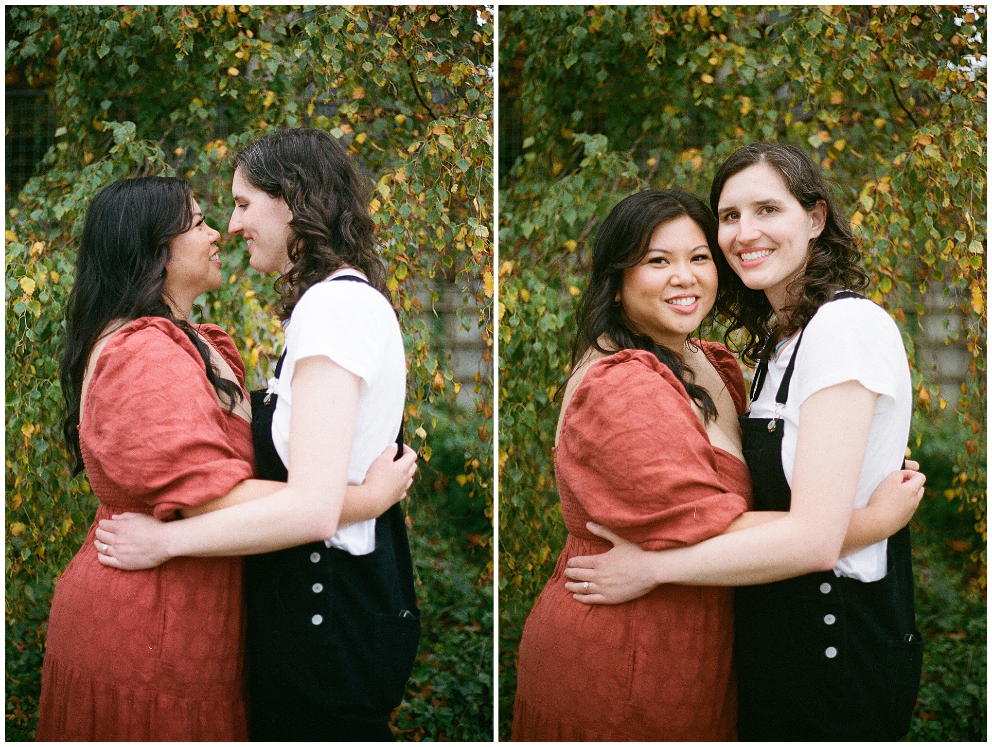 Carli and Erin share a sweet kiss in front of autumn leaves.