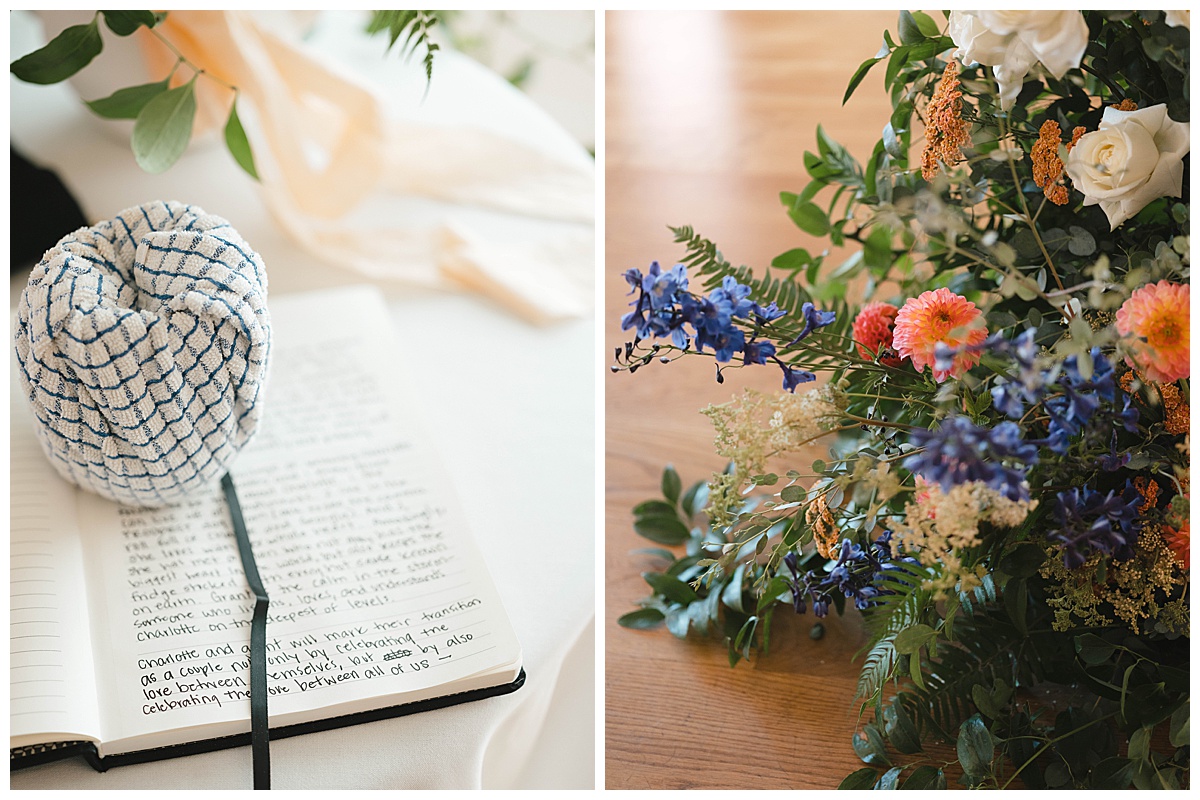 Close-up of a wedding vow book with handwritten vows and a floral arrangement at Block41.