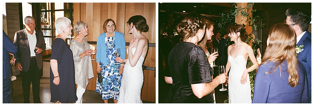 The bride and groom chat with older guests during the wedding reception, sharing smiles and drinks.