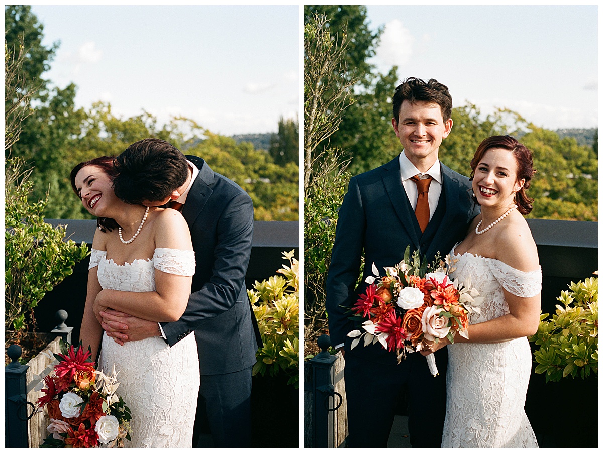 Bride and groom laughing and embracing, holding a bouquet with vibrant autumn florals on the rooftop terrace.