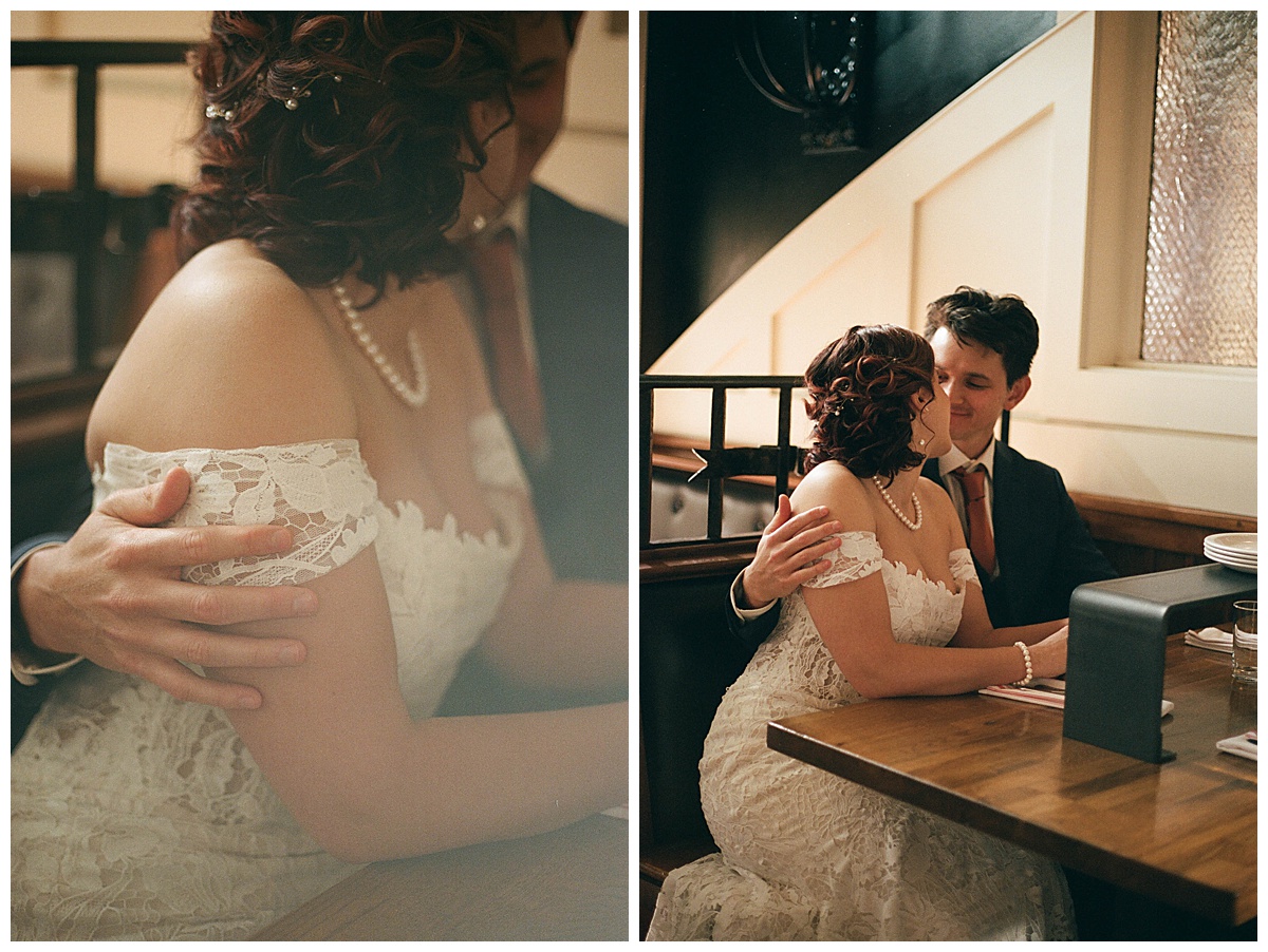 Bride and groom sharing a quiet, romantic moment seated together in the Olympic Rooftop Pavilion interior.