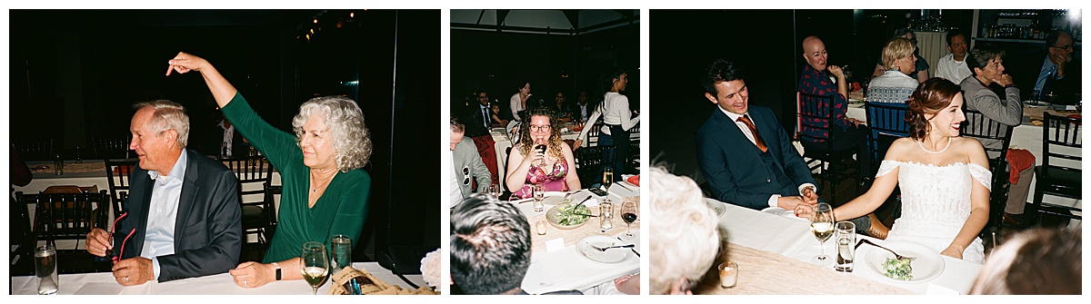 Guests sharing laughter and heartfelt moments during dinner, with the bride and groom smiling at their table.